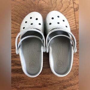 Kids silver crocs.